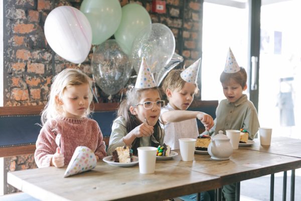 Kids eating cake on a party