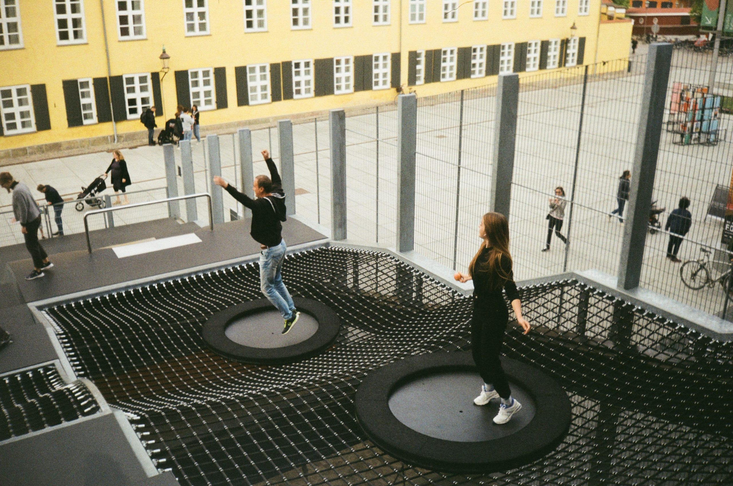 Adults playing trampoline