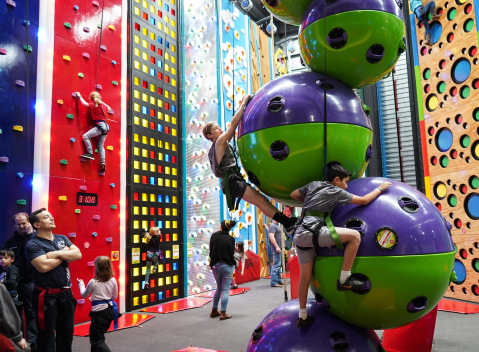 Kids climbing a giant ball